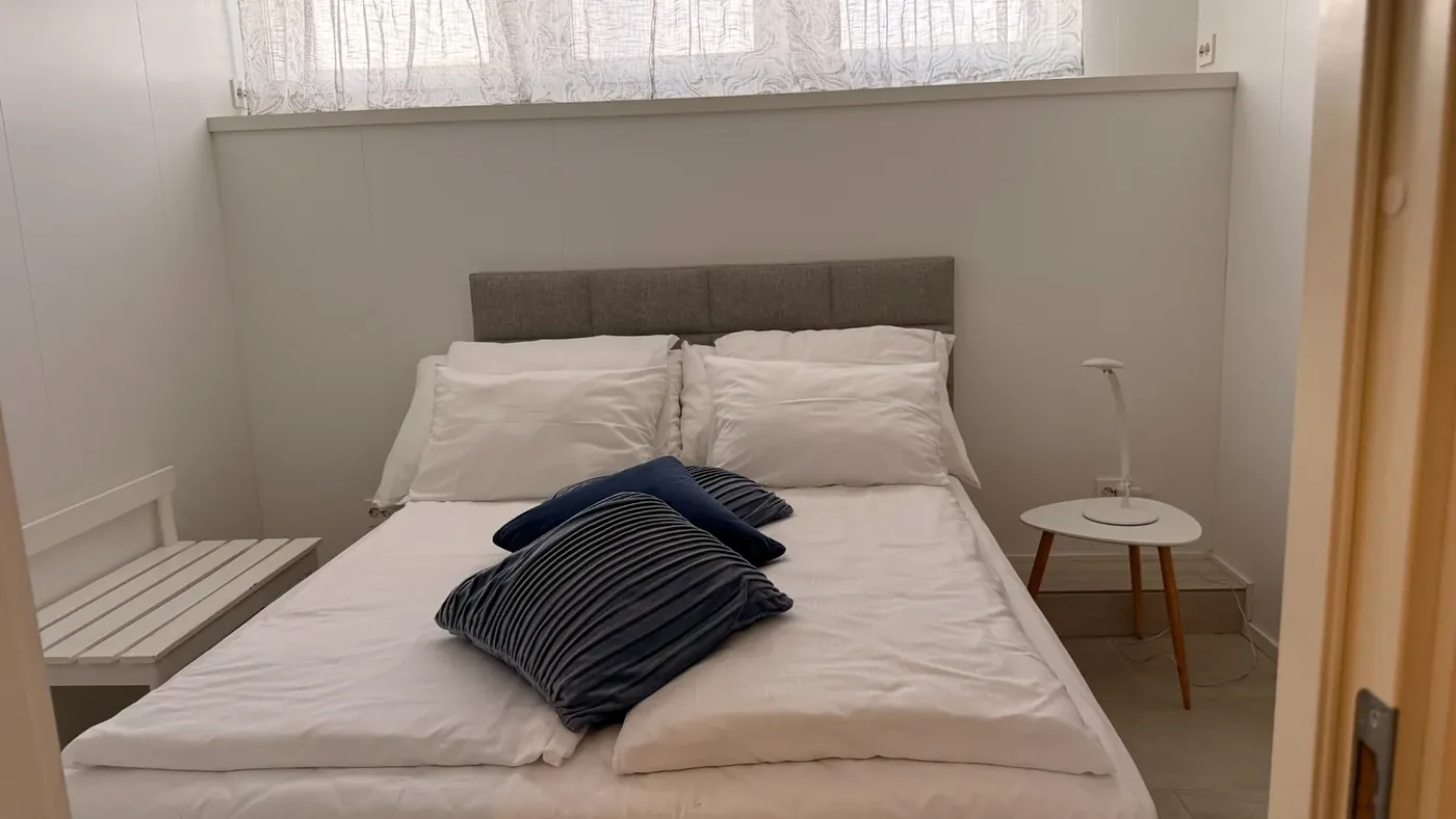Suite med soverom og myke tekstiler